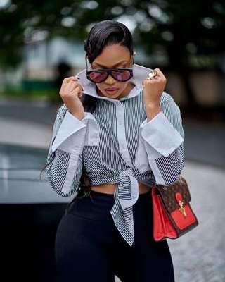 Ratile Mabitsela iconic look, striped shirt with sunglasses