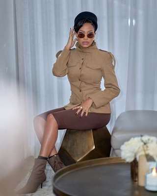 Ratile Mabitsela iconic look, camel jacket and beret